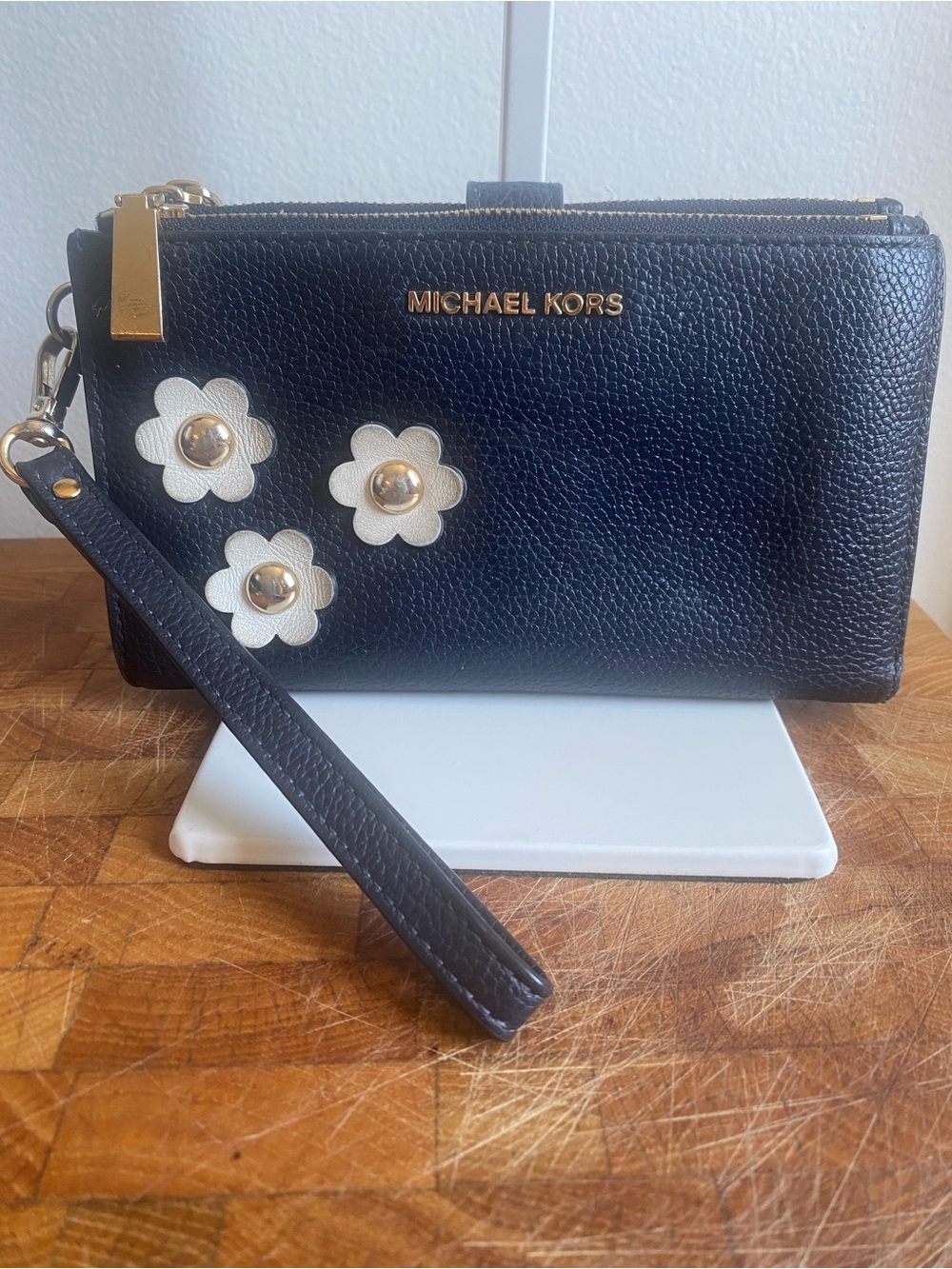 Michael Kors Black Leather Wristlet with White Flower Studs EUC